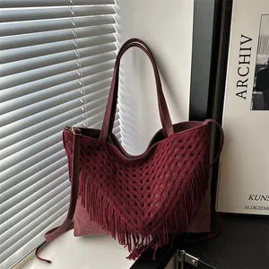 Burgundy oversized tote bag with diamond knit cutout and long fringe tassels