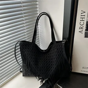 Large black crochet tote bag with fringe tassels and leopard print leather details