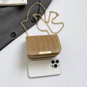Mini velvet chain bag in khaki with vertical quilting and phone size comparison