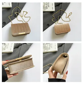 Detail view of khaki velvet crossbody bag with gold chain and vertical stitching