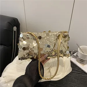 Sparkling gold sequin shoulder bag for evening galas with dual cylindrical handles