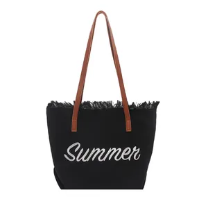 Large black canvas tote bag with Summer embroidery and brown leather straps for women