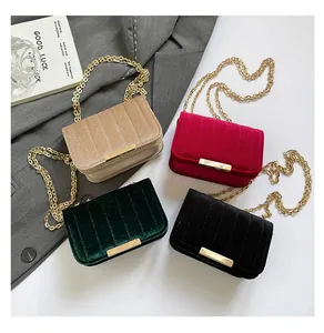 Multiple velvet mini chain bags in beige, burgundy, green and black with gold hardware