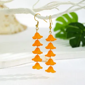 Fresh orange resin lily flower dangle earrings with five layered beads and gold hooks