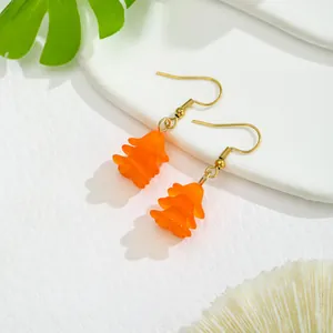 Vibrant orange resin flower petal drop earrings with gold hooks for a fresh look