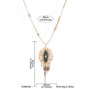 Detailed view of long bohemian necklace with golden pendant and measurements info