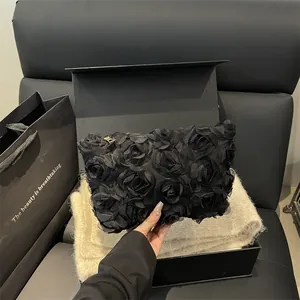 Elegant black 3D rose clutch bag for evening parties with luxury gift box packaging
