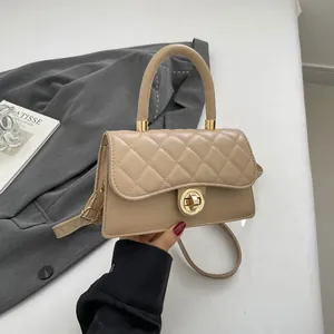 Chic beige quilted square handbag with gold metallic buckle and adjustable strap