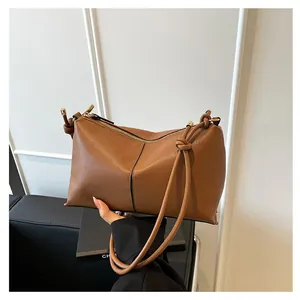 Brown lychee leather shoulder bag with pleated top and gold zipper detail for women