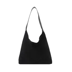 Minimalist black suede hobo shoulder bag with matte finish and wide leather strap