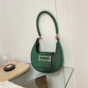 Deep green hobo shoulder bag with crocodile pattern texture and golden hardware