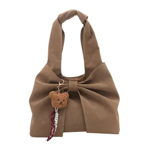 Large brown tote bag with pleated knot handle and cute bear charm for office commute