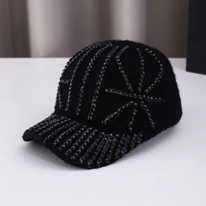 Winter black knit baseball cap with rhinestone Union Jack pattern and plush texture