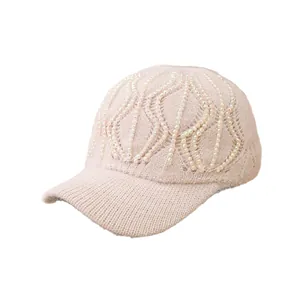 Pink knitted baseball cap with rhinestone pearl embellishments for women's winter warmth