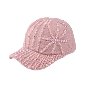 Pink knit baseball cap with sparkly rhinestone embellishments for winter warmth