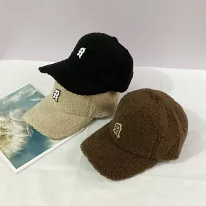 Three warm fuzzy baseball caps in black, beige, and brown with R letter embroidery