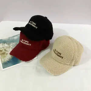 Three lamb wool baseball caps in black, burgundy and beige with letter embroidery detail