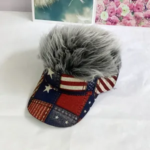 Detail of grey wig visor hat featuring American flag pattern on the brim with fluffy synthetic hair
