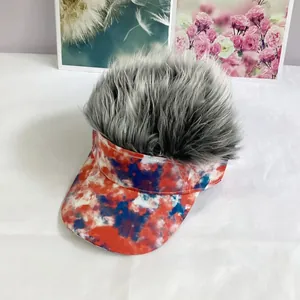 Detail of grey synthetic wig on tie-dye baseball visor with red white blue pattern
