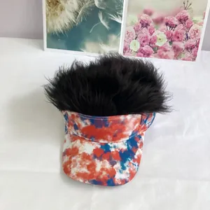 Detail of red white and blue tie-dye visor cap with thick black synthetic hair strands