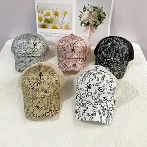 Glitter mesh baseball caps with graffiti lettering in multiple colors for street style