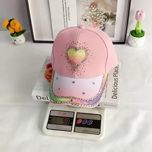 Detail showing gradient rhinestone heart on baseball cap with weight of 98 grams