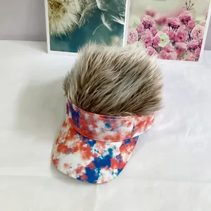 Top view of tie-dye sun visor with fluffy synthetic hair and cloud pattern detail