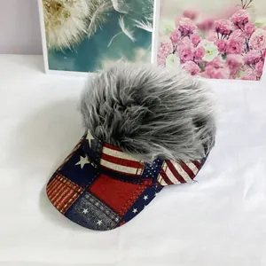 Detailed view of novelty visor hat with grey wig hair and American flag pattern brim