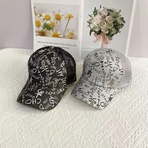 Detail of hip hop mesh baseball caps with graffiti prints in black and silver gray tones
