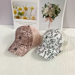 Graffiti glitter trucker hats in pink and white with breathable mesh and sequins