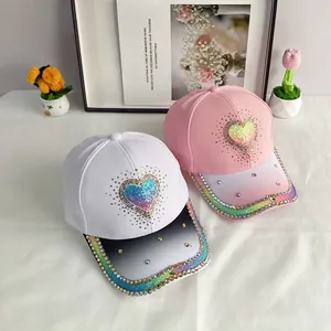 Detailed view of kids gradient baseball caps with glitter heart and rhinestone rim decor