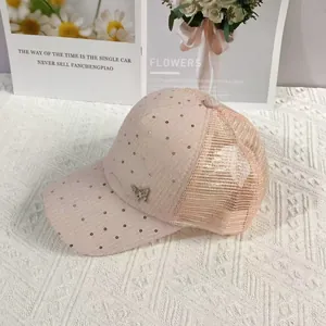 Pink mesh baseball cap featuring glitter sequins and a detailed metal butterfly ornament