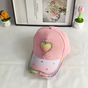 Detail of pink baseball cap with gradient sequin heart and sparkling rhinestone accents