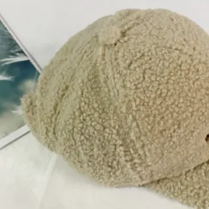 Close-up of khaki lamb wool baseball cap featuring textured fleece fabric and round crown