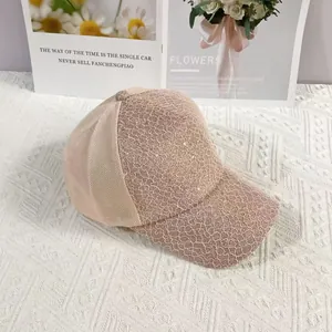 Detailed view of pink floral lace patterns and breathable mesh on baseball cap