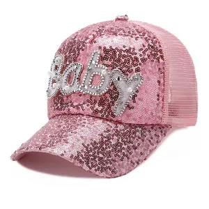 Detail of pink sequins and pearl-studded Baby logo on a breathable mesh baseball cap