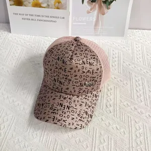 Detailed view of pink glitter baseball cap with mesh back and metallic JEANS ornament
