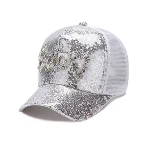 Detailed view of silver sequin baseball cap with pearl and rhinestone Baby lettering