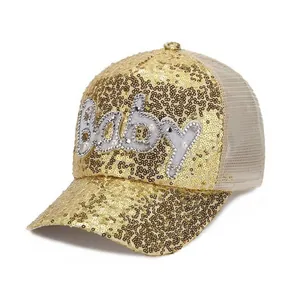 Detail of baby sequin mesh cap with pearl letter embroidery and gold sequins