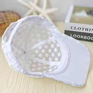 Close-up of breathable white lace mesh baseball cap showing interior stitching details