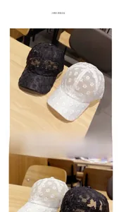 Detail of floral lace mesh baseball caps in black and white with breathable embroidery