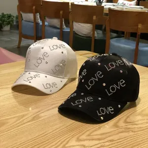 Women's silk satin baseball caps with rhinestone love lettering in black and white colors