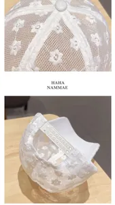 Detailed view of white floral lace fabric and adjustable snapback closure on baseball cap