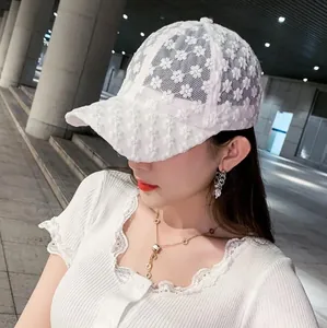 Elegant white lace baseball cap with floral embroidery for women's summer sun protection