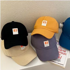 Detailed group shot of five cotton baseball caps with 83 original legend patch
