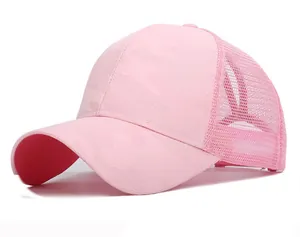 Detailed view of pink camouflage trucker hat with breathable mesh back and curved brim