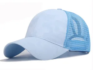 Close-up of light blue ponytail baseball cap with camo pattern and breathable mesh back