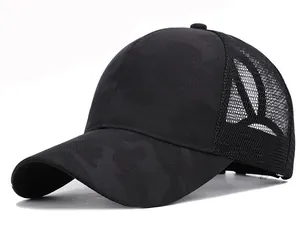 Close-up of black camo mesh baseball cap featuring ponytail hole and breathable net back