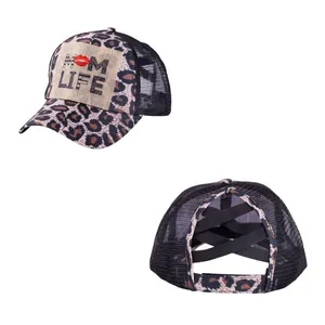Detail view of Mom Life leopard print mesh cap with criss-cross ponytail elastic bands