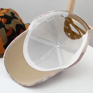 Detailed interior of camo ponytail beanie hat with elastic criss-cross bands and warm lining